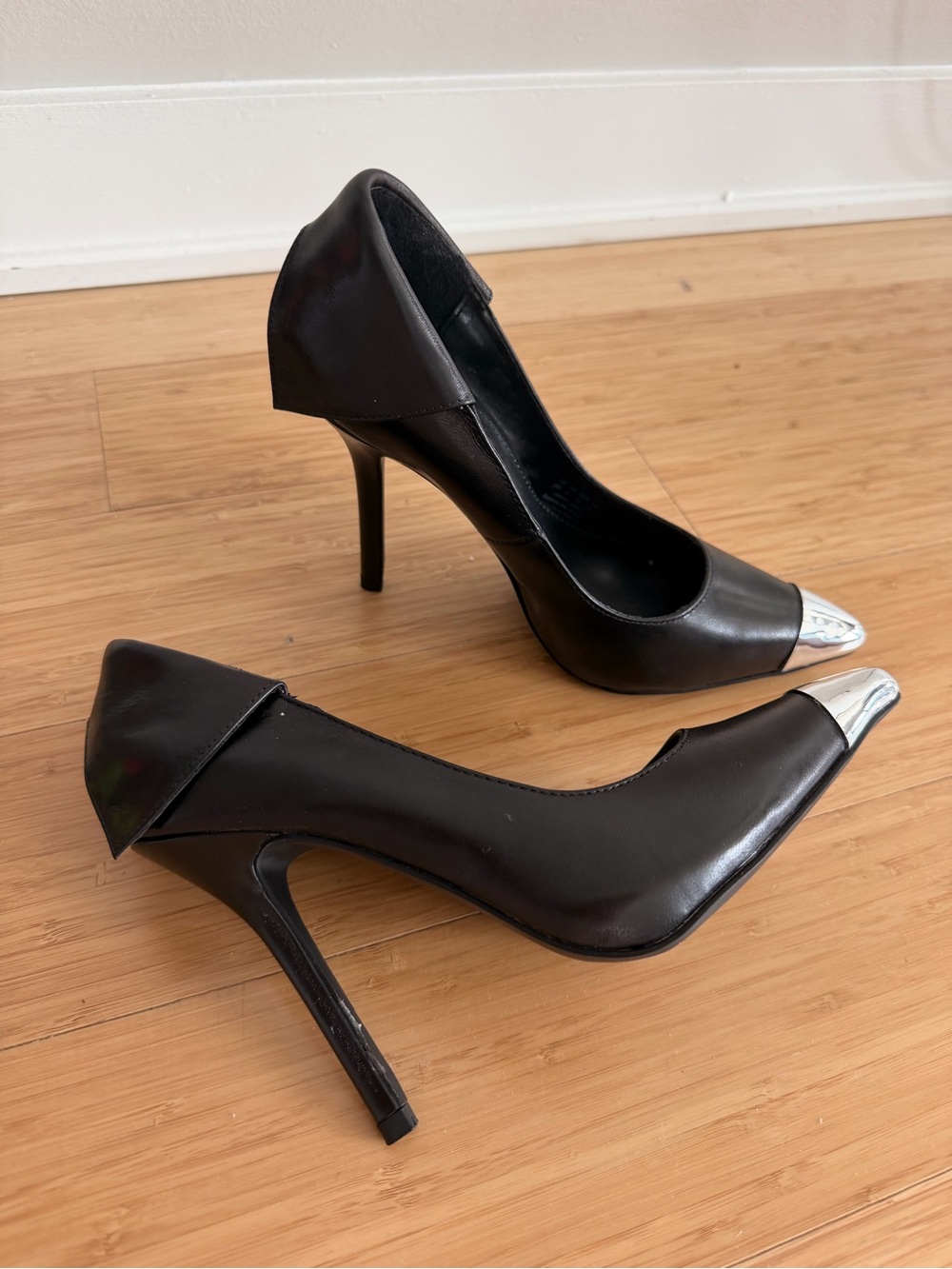 Fergie Black Pumps with Silver Cap Toe